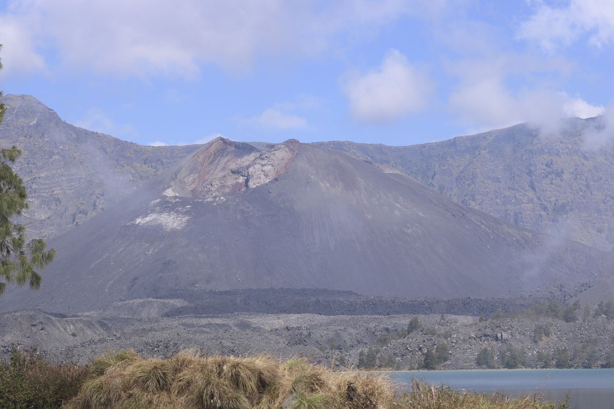 Gunung Baru Jari, the active cone inside the caldera, rising from the shore of Segara Anak lake
