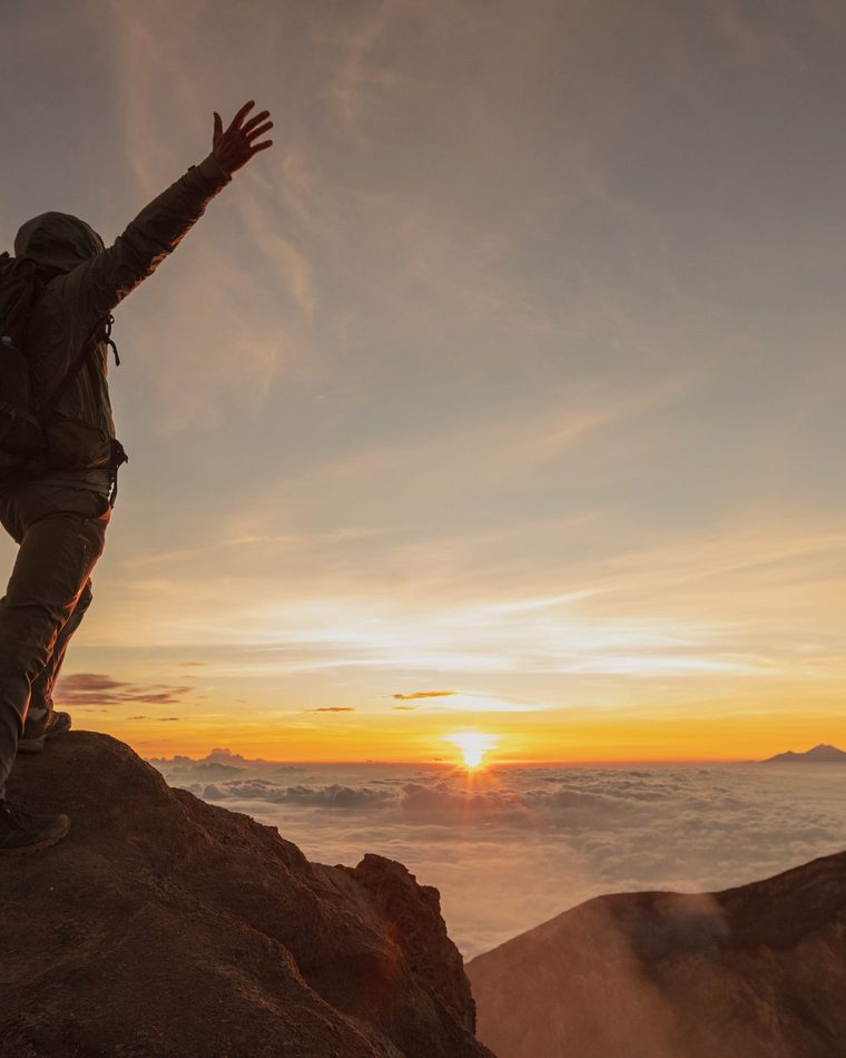 Trekker on the Rinjani summit at sunrise