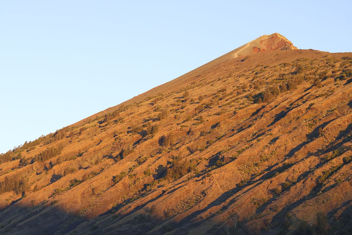 First light on the summit ridge of Mount Rinjani